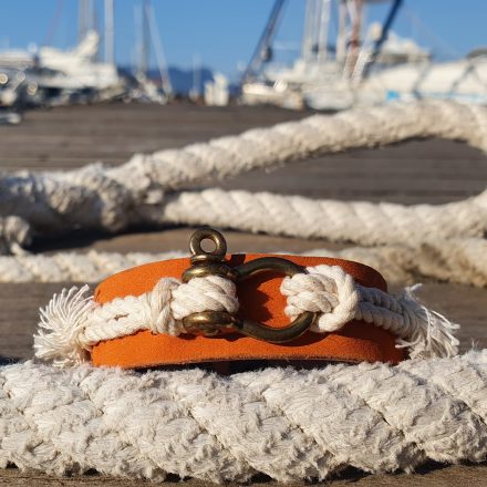 Leather bracelet The ‘Poniente’ with a brass mini shekel combained with a cotton rope – orange